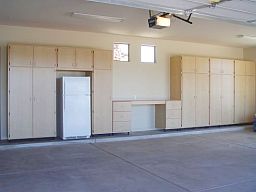 large wall unit custom combination of various sizes of garage cabinets built around a freezer